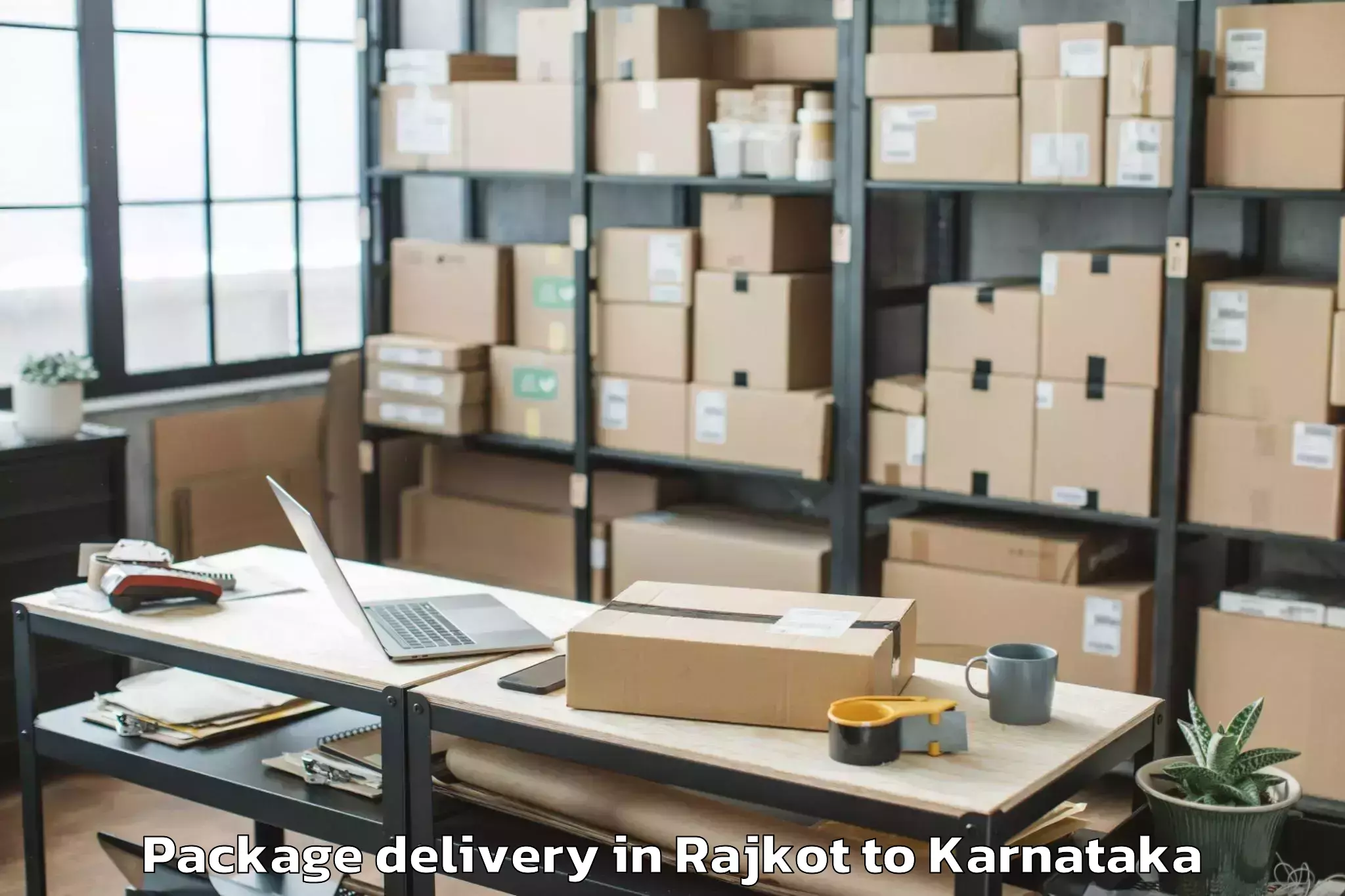 Rajkot to Karnataka State Law University Package Delivery